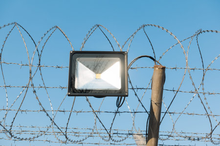 LED lamp and barbed wire.
