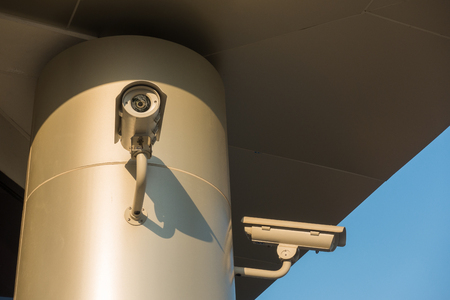 Security CCTV camera and surveillance cam system in modern office buildingの写真素材