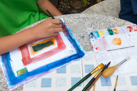 little cute boy painting with water color, lifestyle people conceptの写真素材