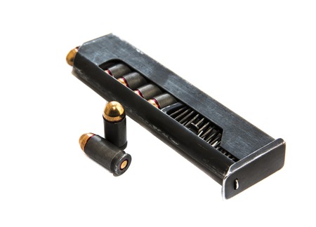 Gun magazin or cartridge with bullets isolated on white backgroundの写真素材