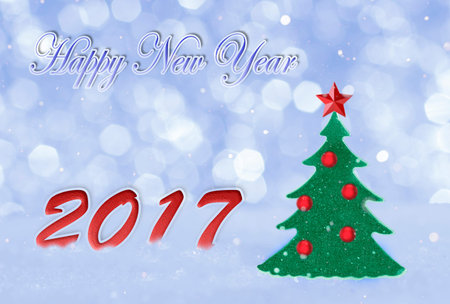 Christmas card for greetings. Stylized fir on snow in shades of blue with the words Merry Christmas