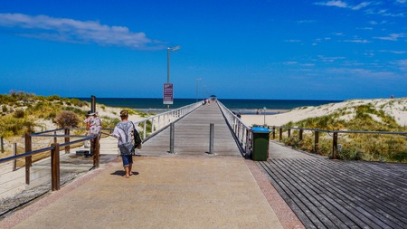 people are returning to the sunny beach of the Pacific Ocean. Adelaide South Australia 2017の写真素材