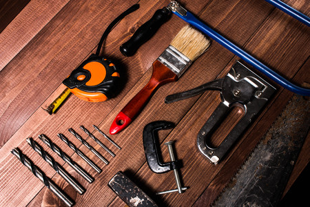 Set of hand tools on a wooden tableの写真素材