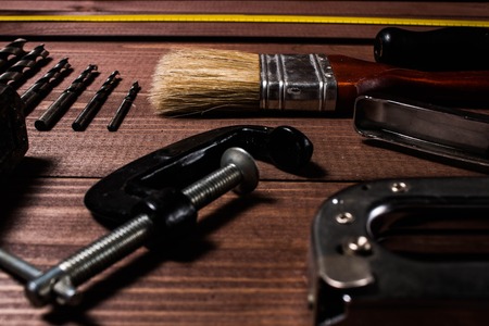 Set of hand tools on a wooden tableの写真素材