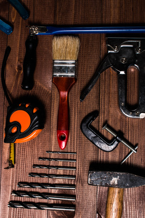 Set of hand tools on a wooden tableの写真素材