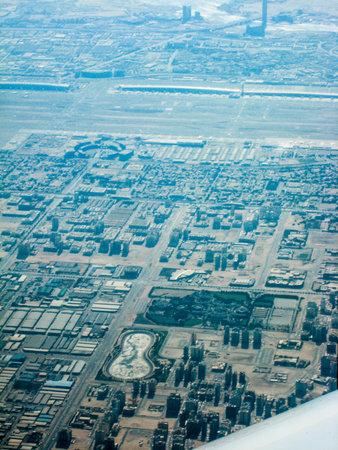 panorama city Dubai UAE from the window of a passenger planeの写真素材