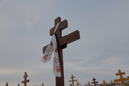 christian cemetery with wooden crosses in winter