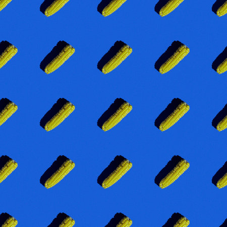 bright flat seamless pattern of peeled corn on a blue backgroundの写真素材