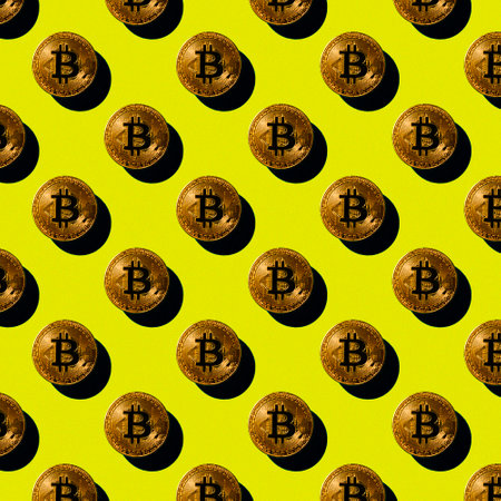 flat seamless pattern of gold bitcoin coins on a yellow background with a shadow, cryptocurrencyの写真素材