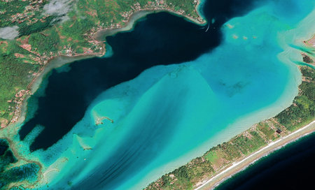 Aerial photography of bungalows and lagoons in Bora Bora French Polynesia