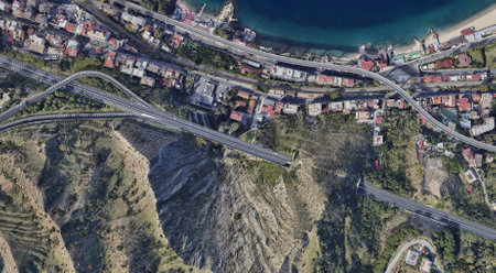 Reggio Calabria's Coastline from Above: Ionian Sea and Urban Landscape in summerの写真素材