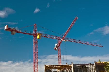 Building tower cranes against the skyの写真素材