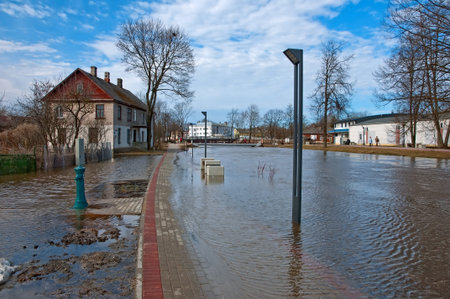 Urban river embankment submerged by flood