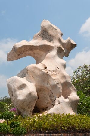 Park ancient stones decorated with flowers and plantsの写真素材