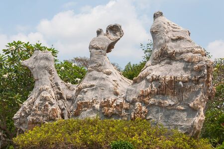 Park ancient stones decorated with flowers and plantsの写真素材