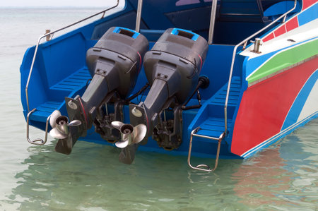 motorboat with two motors raised over sea water