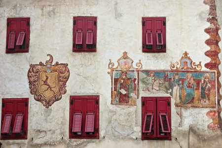 Detail of the facade of a house in the old town of Rumo in Val di Non, Northern Italyの写真素材