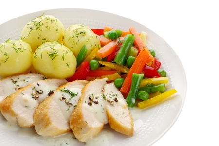 Chicken breast with vegetables and sauce の写真素材