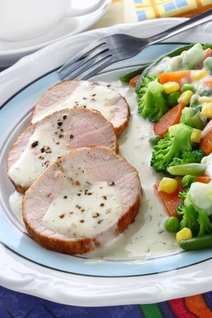 Pork meat with vegetables and sauce の写真素材
