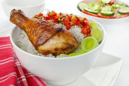 Fried chicken leg with rice and vegetablesの写真素材