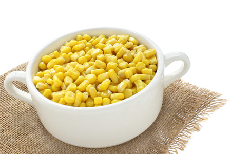 Sweet corn in a bowl isolated on a white background