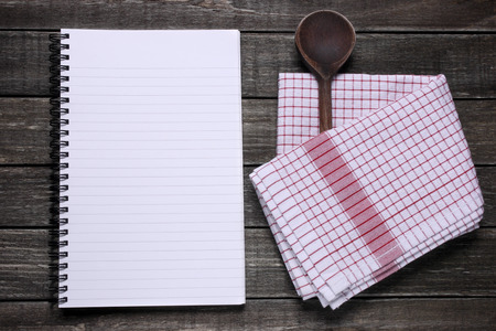 Notebook and canvas on wooden table の写真素材