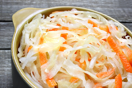 Sauerkraut with carrot in bowl の写真素材