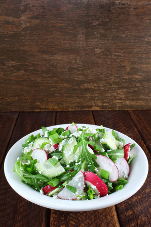 Salad with arugula, cucumber, cottage cheese and radishの写真素材