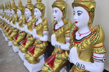 Native Thai style angel statue at public temple, Northern Thailandの写真素材