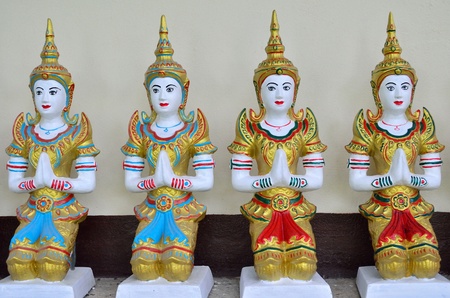 Native Thai style angel statue at public temple, Northern Thailandの写真素材