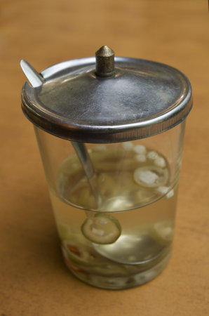 Vinegar and pepper in a glass with aluminum lids for food additives at the noodle restaurant 