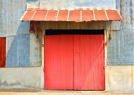 The old zinc door of the factory の写真素材