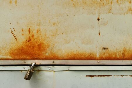 Background of rusty grunge metal trunk with master keyの写真素材