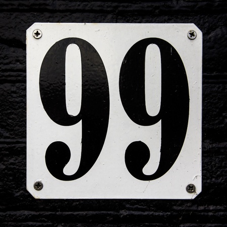 modern house number twenty attached to al black paintedbrick wallの写真素材