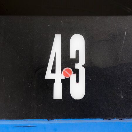 house number fory-three on a dirty glassの写真素材