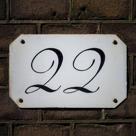 house number 22 ataached to abrick wallの写真素材