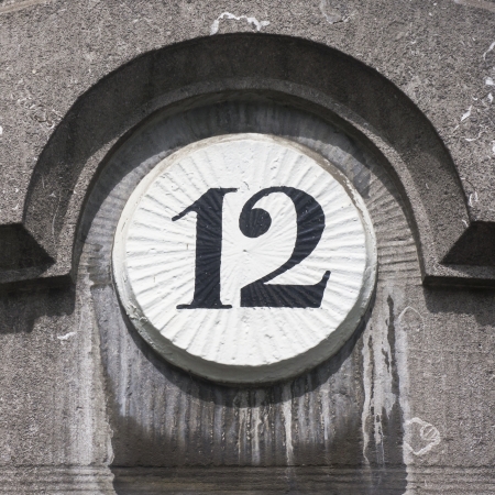 house number twelve painted on a round ornamentの写真素材