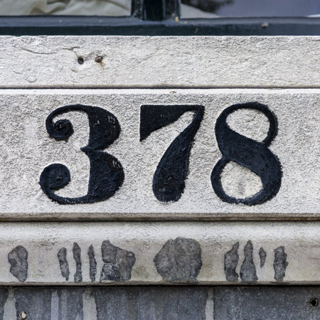 house number three hundred and seventy-eight, carved in stone