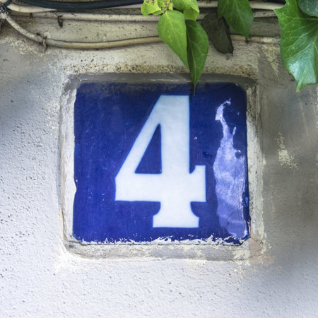 glazed house number four, next ot some green leafs