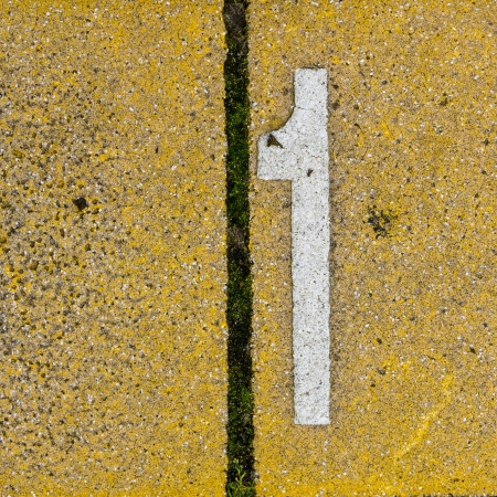 Number one on colored pavement tiles.の写真素材