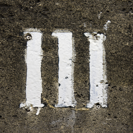 House number one hundred and eleven, hand painted on a stone wall の写真素材