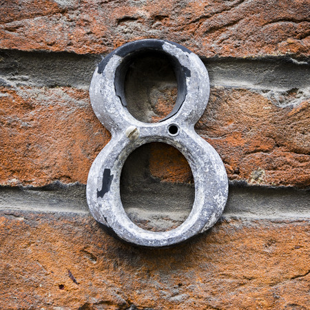 weathered house number eight, made of cast aluminumの写真素材