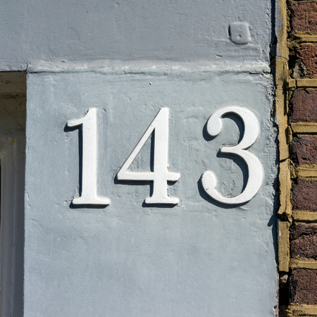 embossed house number one hundred and forty threeの写真素材