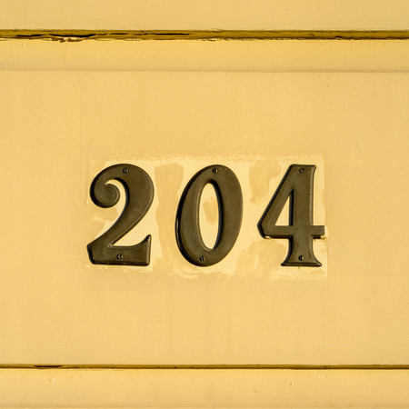 bronze house number two hundred and four.の写真素材