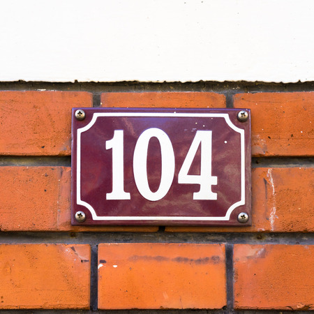enameled house number one hundred and fourの写真素材