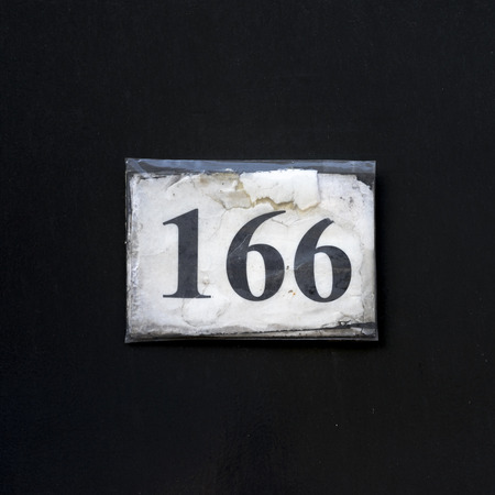 paper house number one hundred and sixty six, wrapped in plastic.の写真素材