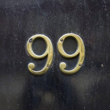 Brass house number ninety nine.の写真素材