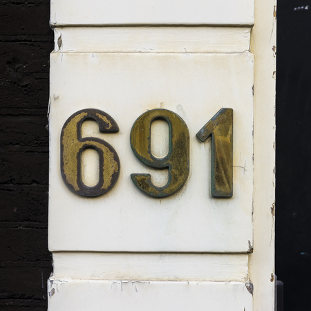 brass house number six hundred and ninety one (691)の写真素材