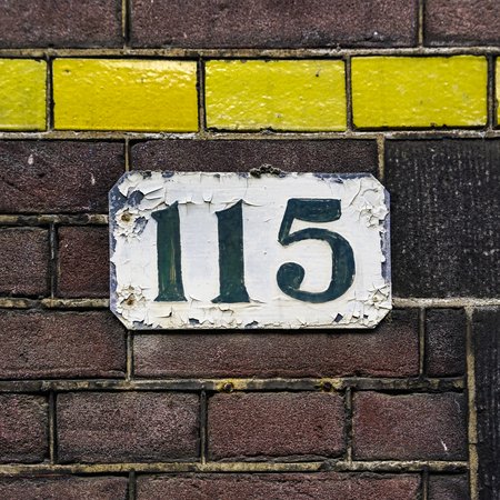 House number one hundred and fifteen.の写真素材