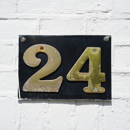 brass house number twenty four.の写真素材